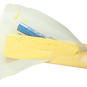 Stick of Butter in Paper Unwrapped Over White Background