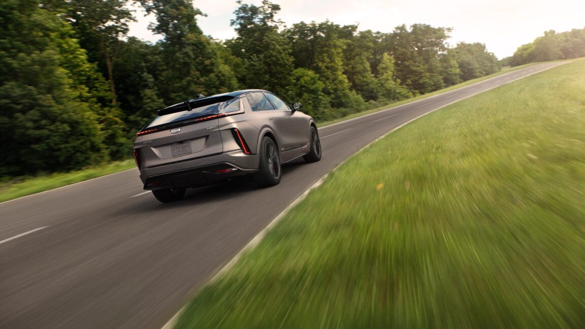 A Cadillac Lyriq-V drives away from the camera