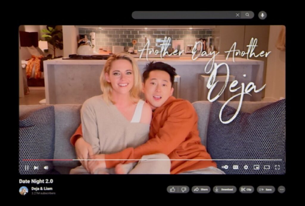 YouTube screenshot showing a young blond woman and Asian man embracing o a living room sofa