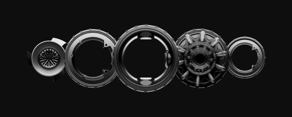 A row of five donut-shaped electric motors on a black background