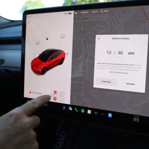 A software update alert appears on the screen of a Tesla Model 3 car on May 31, 2024 in San Anselmo, California.