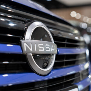 The Nissan logo on the front of a vehicle
