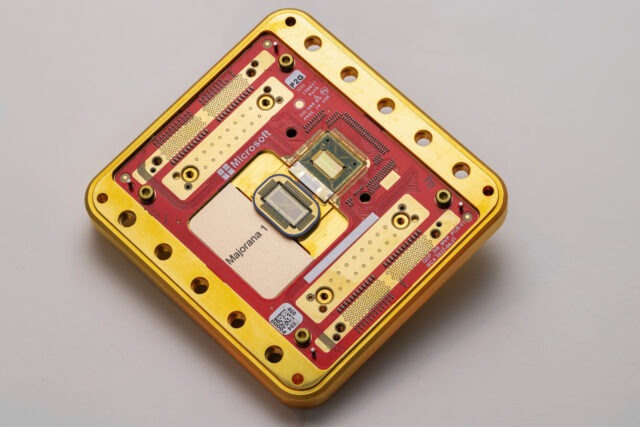 Image of a processor and its packaging, which is rectangular and primarily red and gold.
