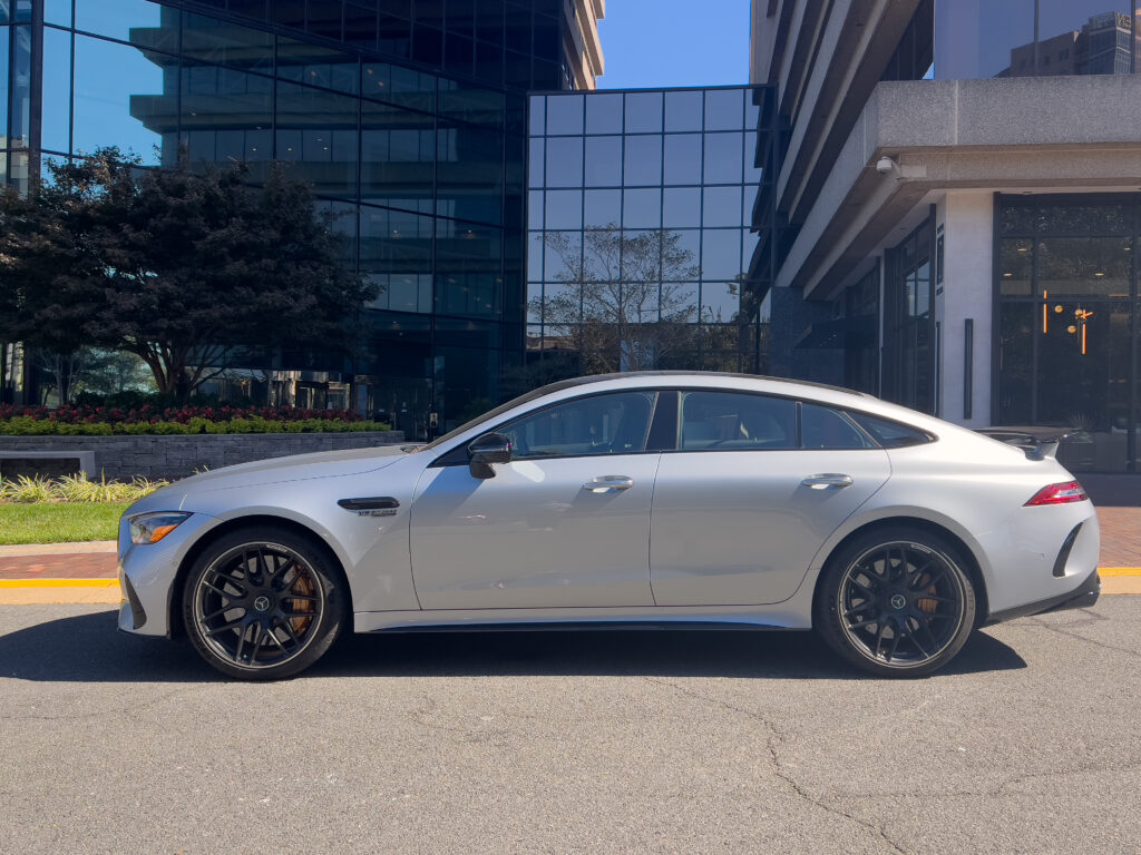 A silver Mercedes-AMG four door in profile