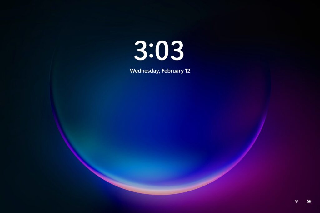 A Windows 11 lock screen showing nothing but the date and time.