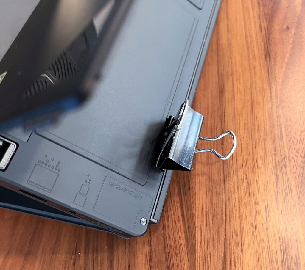 Binder clip stuck magnetically onto the back of the Asus ROG Flow Z13