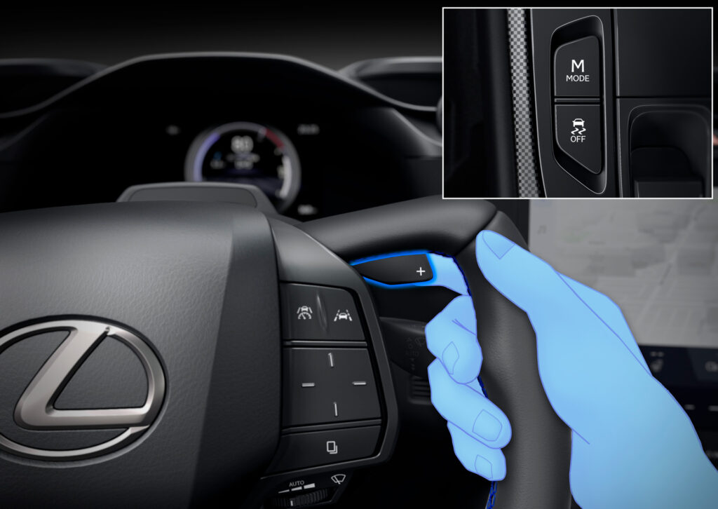 An illustration of a hand holding the Lexus RZ steering wheel, demonstrating how to use the lever to "shift"