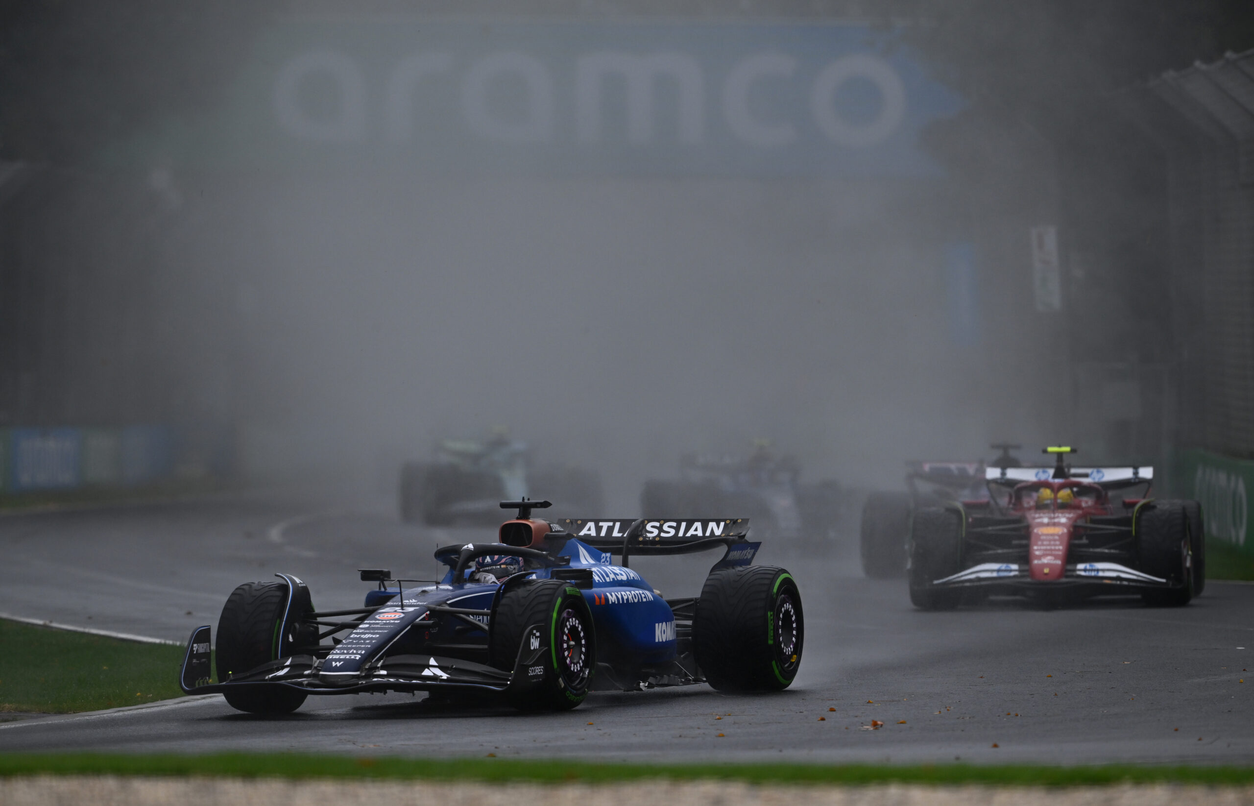 MELBOURNE, AUSTRALIA - MARCH 16: Alexander Albon of Thailand driving the (23) Williams FW47 Mercedes leads Lewis Hamilton of Great Britain driving the (44) Scuderia Ferrari SF-25 on track during the F1 Grand Prix of Australia at Albert Park Grand Prix Circuit on March 16, 2025 in Melbourne, Australia.