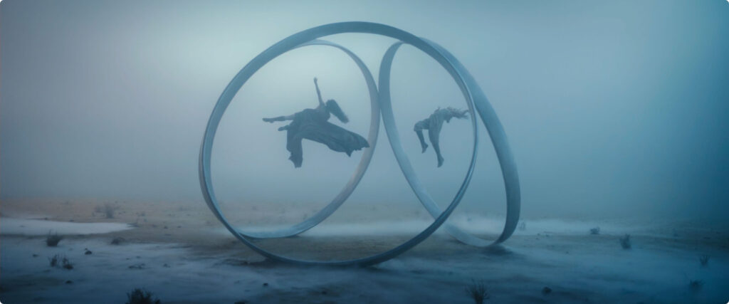 Image showing two people floating in rings.