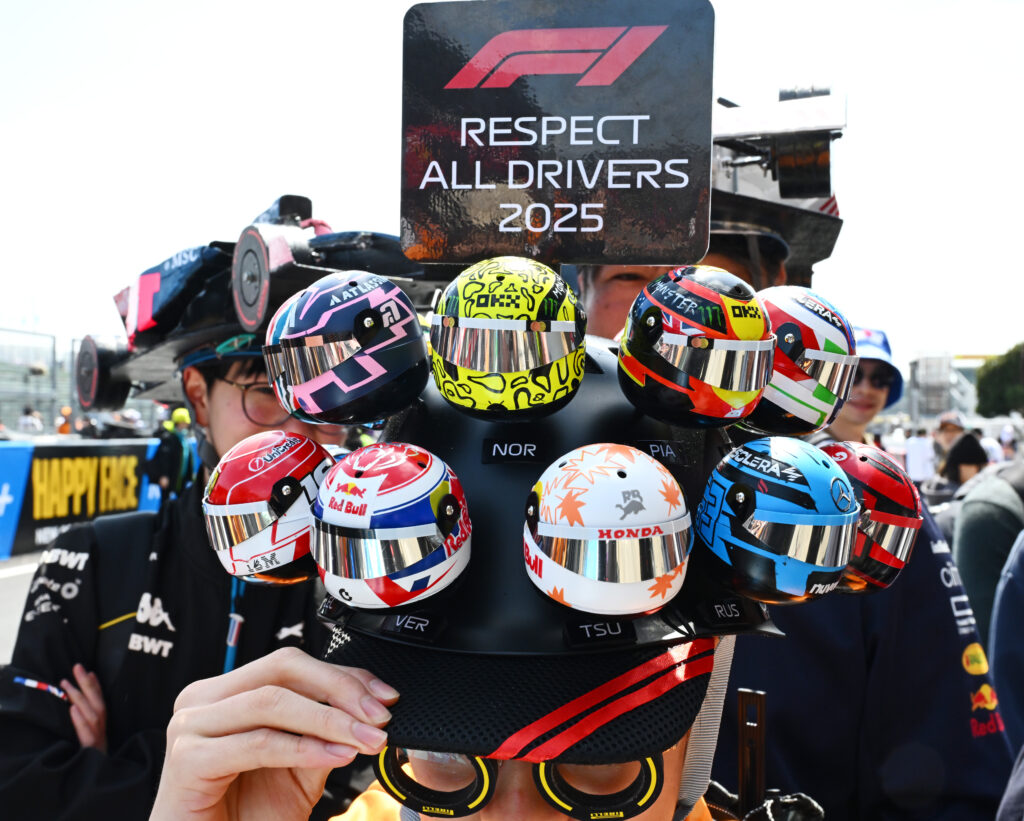SUZUKA, JAPAN - APRIL 03: A fan with models of the drivers helmets during previews ahead of the F1 Grand Prix of Japan at Suzuka Circuit on April 03, 2025 in Suzuka, Japan.