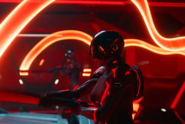 futuristic digital realm featuring human figures in helmets on light cycles