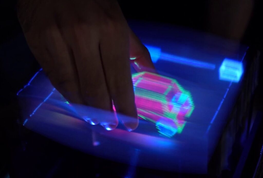 A 3D car is grabbed and rotated by a user.