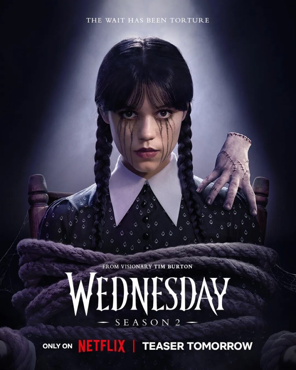 poster art showing dark haired girl with portals and black ink running from her eyes while a detached hand perches on her shoulder