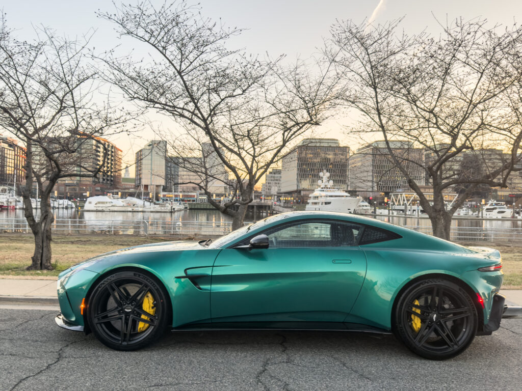 Aston Martin Vantage seen in profile, parked by the river