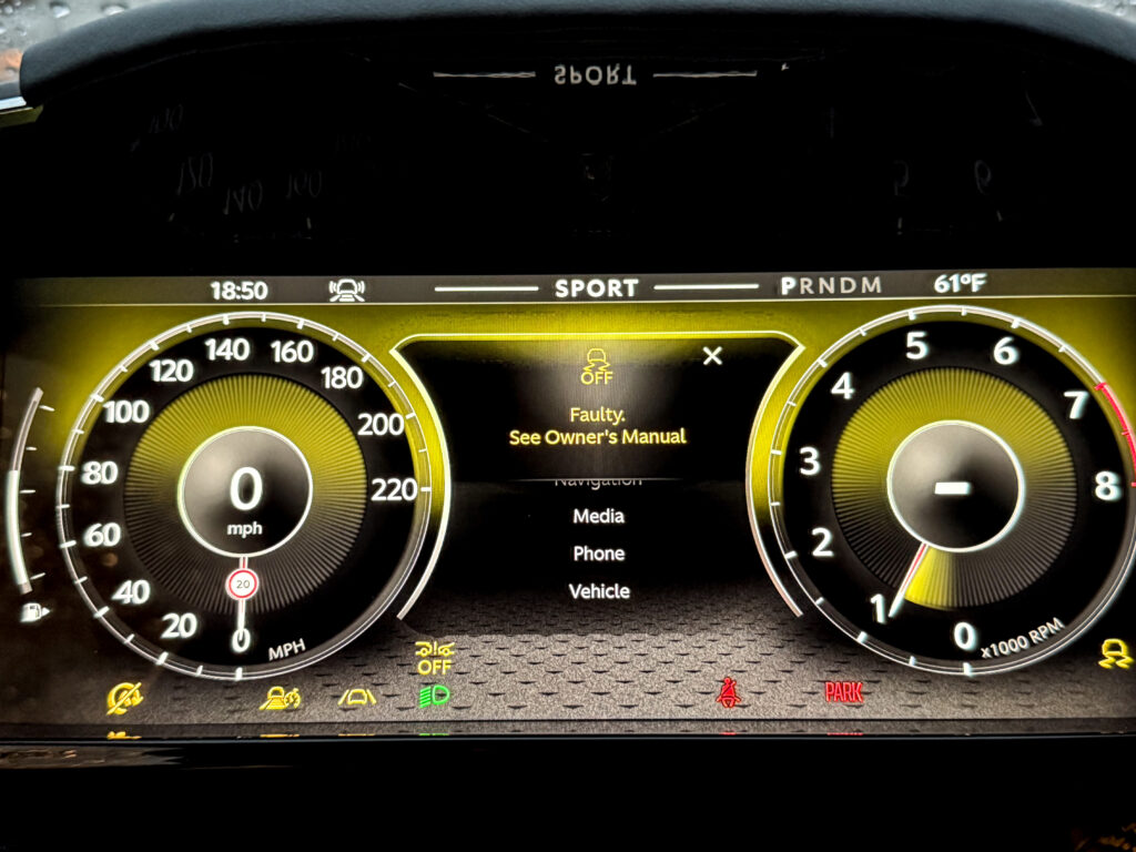 Aston Martin Vantage main instrument display, showing error messages and warning lights.