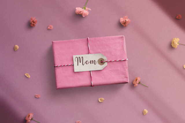 Photo of a small wrapped box with "Mom" label affixed