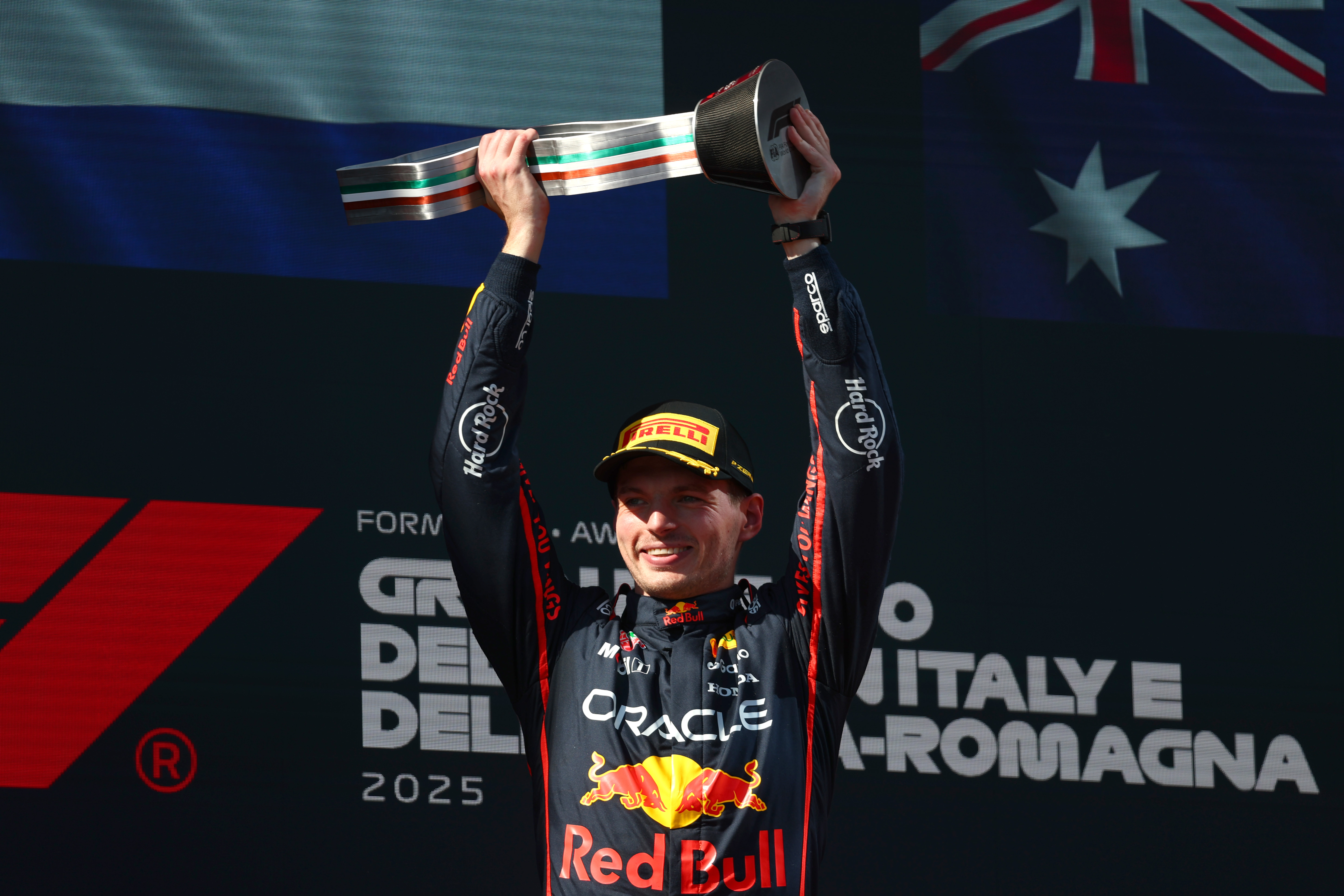 IMOLA, ITALY - MAY 18: Race winner Max Verstappen of the Netherlands and Oracle Red Bull Racing celebrates on the podium during the F1 Grand Prix of Emilia-Romagna at Autodromo Internazionale Enzo e Dino Ferrari on May 18, 2025 in Imola, Italy.