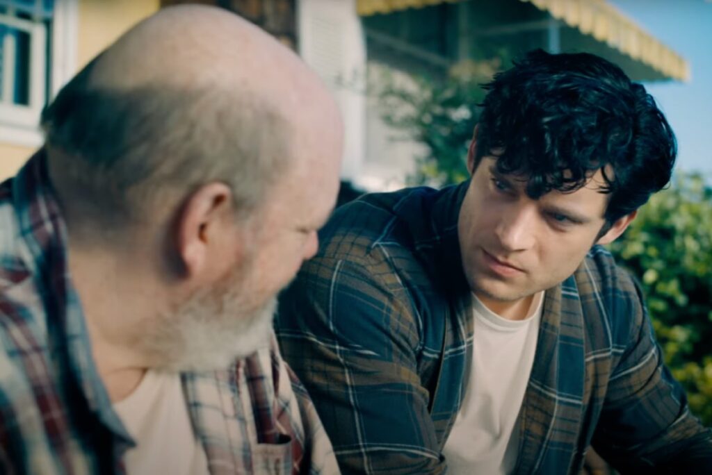 Clark Kent in plaid shirt talking to his dad