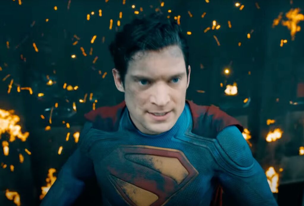 Superman in mid-air with bomb remnants behind him.