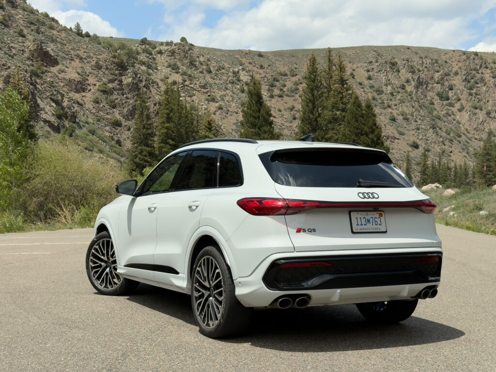 Audi SQ5 from behind, in front of some mountains.