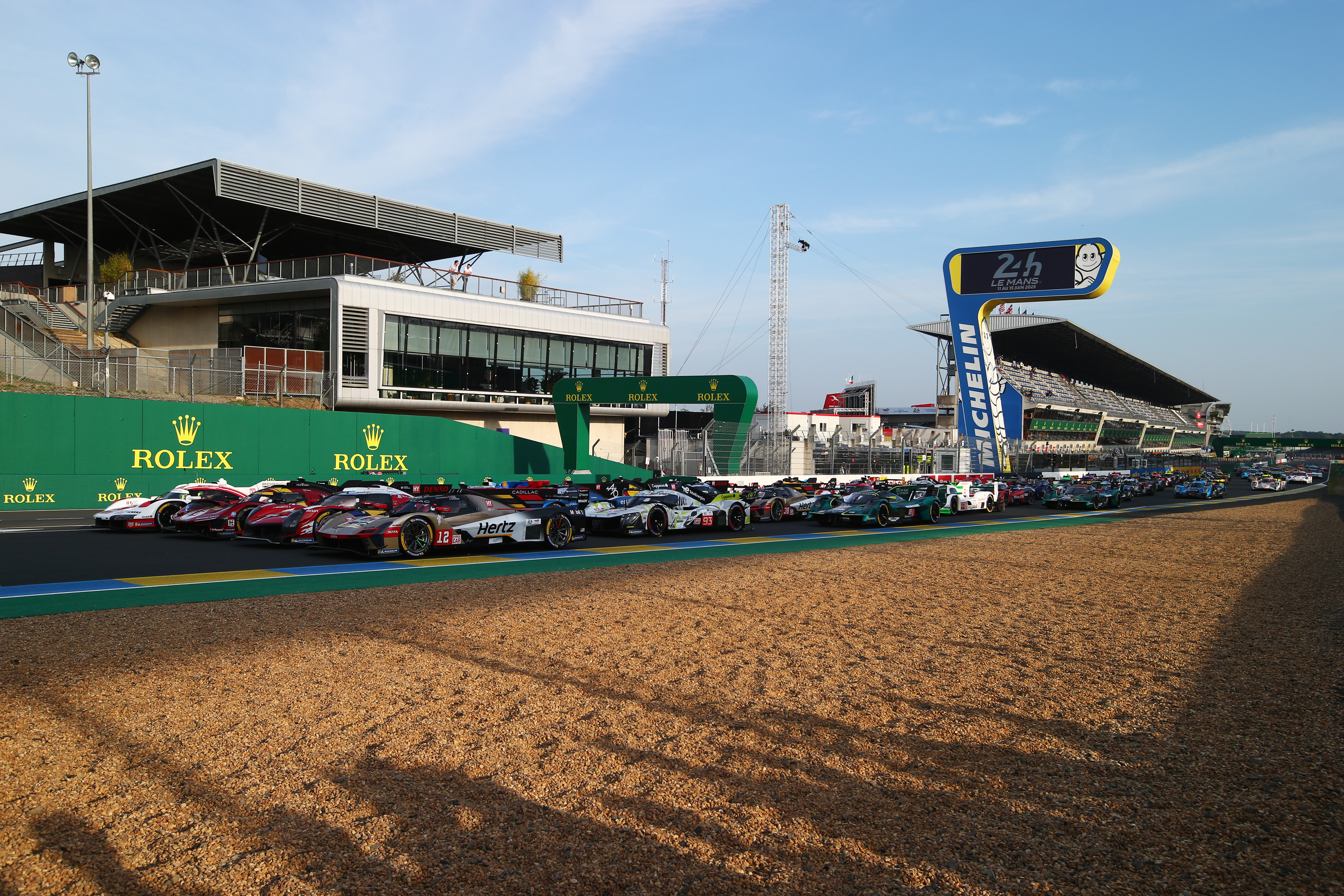  The Penske Porsche, Ferrari AF-Corse, Toyota Gazoo Racing and Jota Cadillac sit on the front row as the 2025 Le Mans entry sits for a group picture on the main straight at the Circuit de la Sarthe on June 10, 2025 in Le Mans, France.