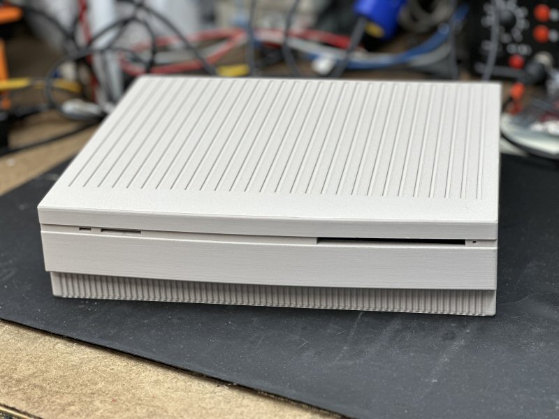 A 3D-printed "SE Mini" desktop case that allows using a vintage compact Mac board in a new enclosure.