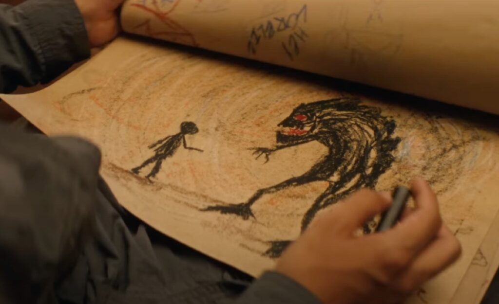 child's crude drawing showing a small human figure facing off against a cartoonish xenomorph.