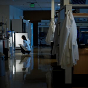A woman in a mostly empty lab
