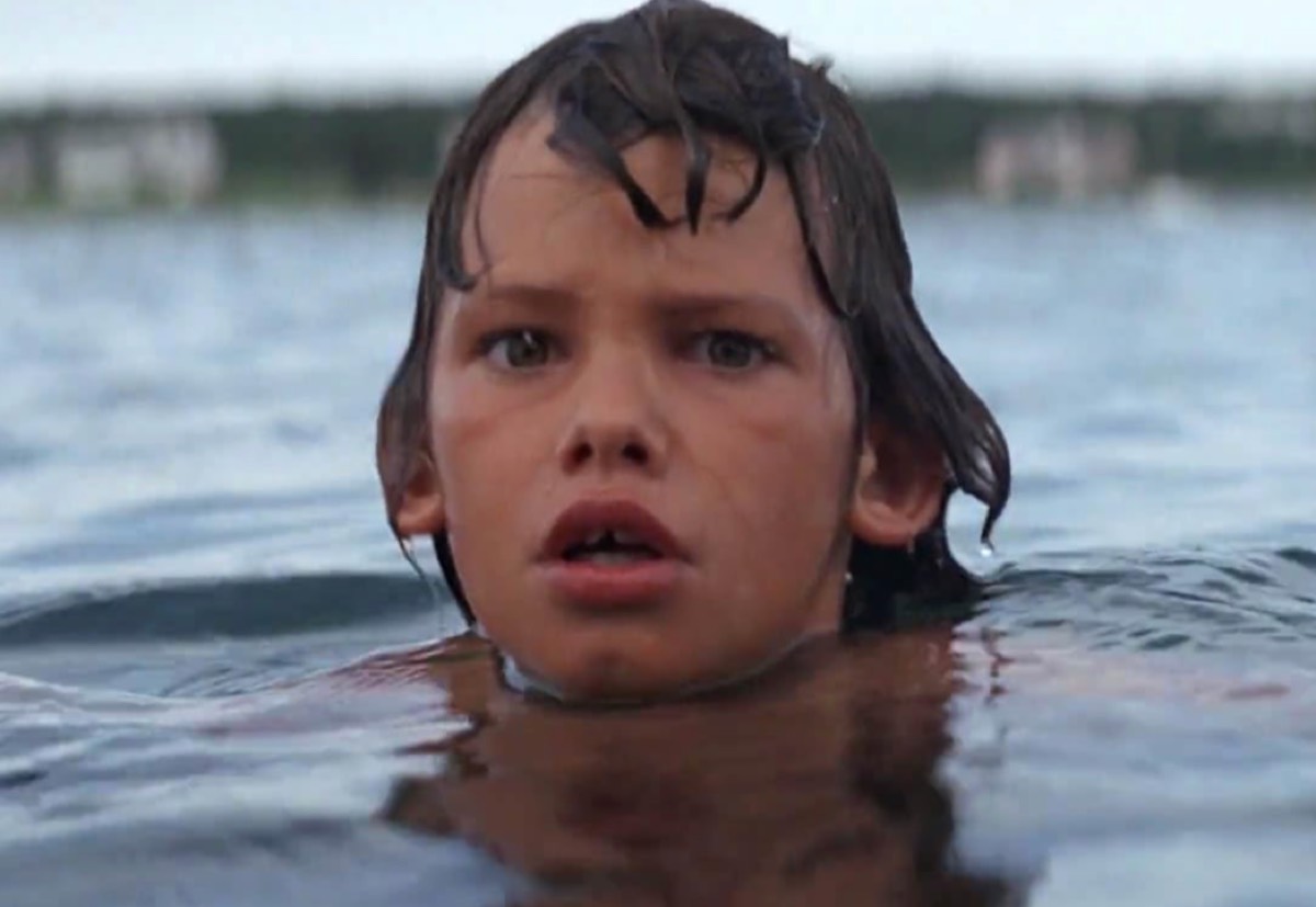 terrified young boy's head sticking out of the eater