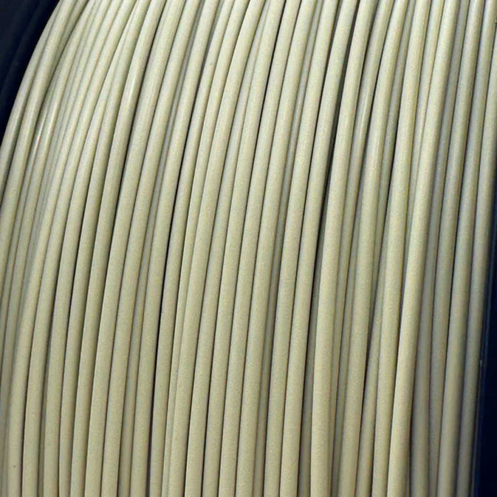 A close-up of "Retro Platinum" PLA filament by Polar Filament.