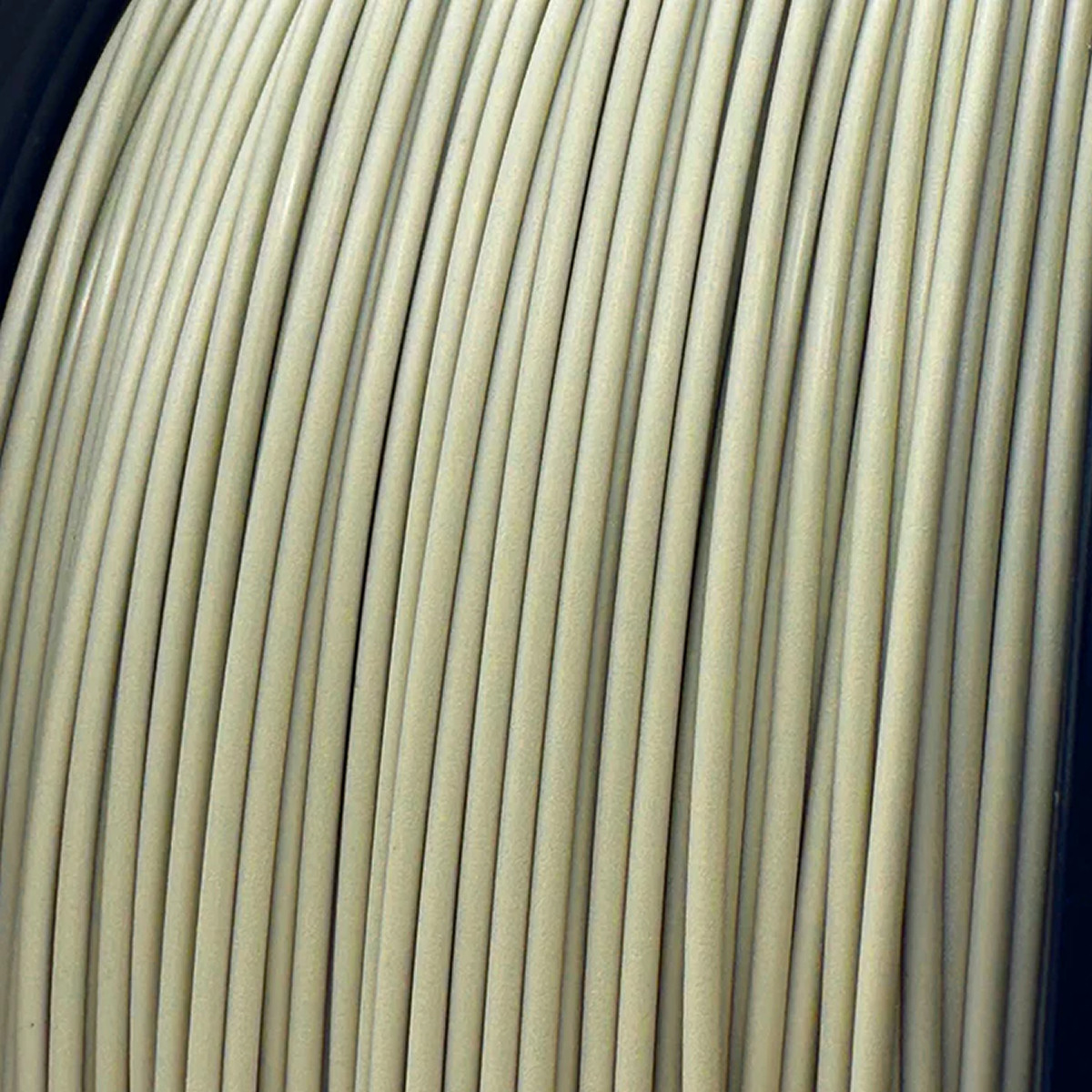 A close-up of 'Retro Platinum' PLA filament by Polar Filament.