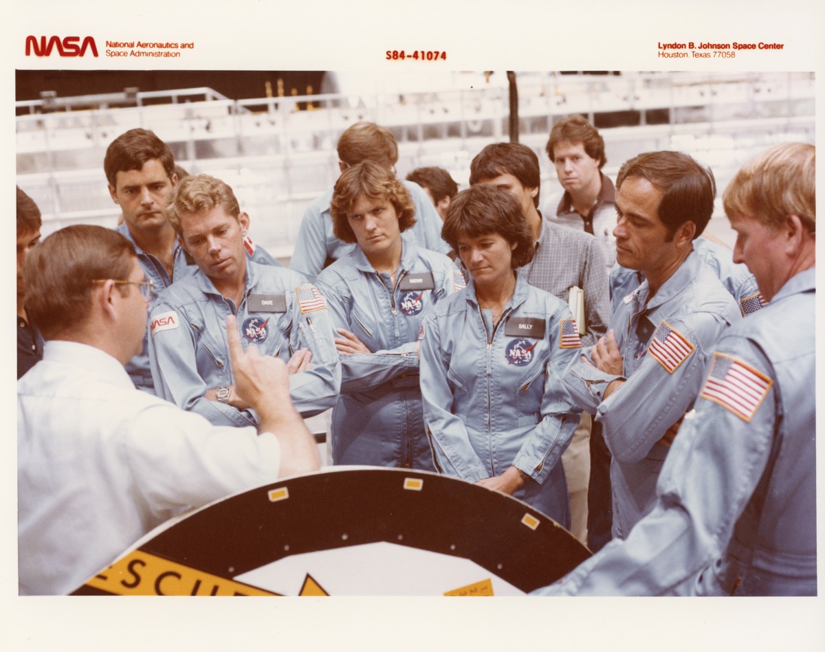 Sally Ride and fellow astronauts, including Kathy Sullivan and Bob Crippen, during training at NASA Johnson Space Center in 1984.