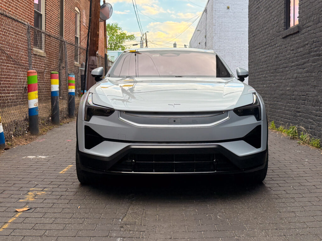 Polestar 3 seen from ahead, in an alley
