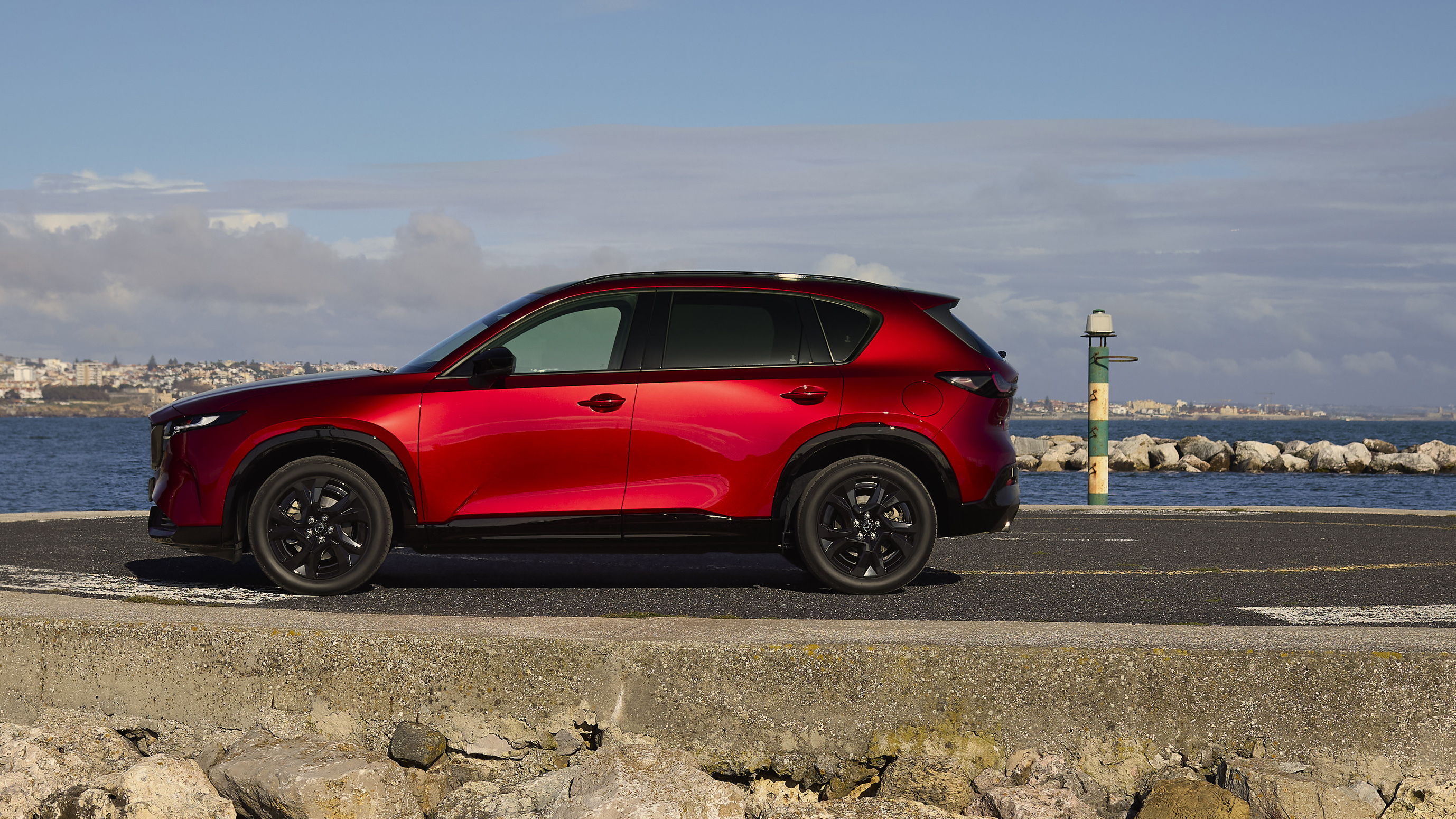 A red third-generation Mazda CX-5 in profile