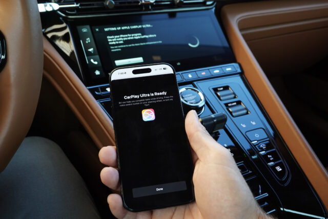 An iPhone connected to an Aston Martin using CarPlay ultra