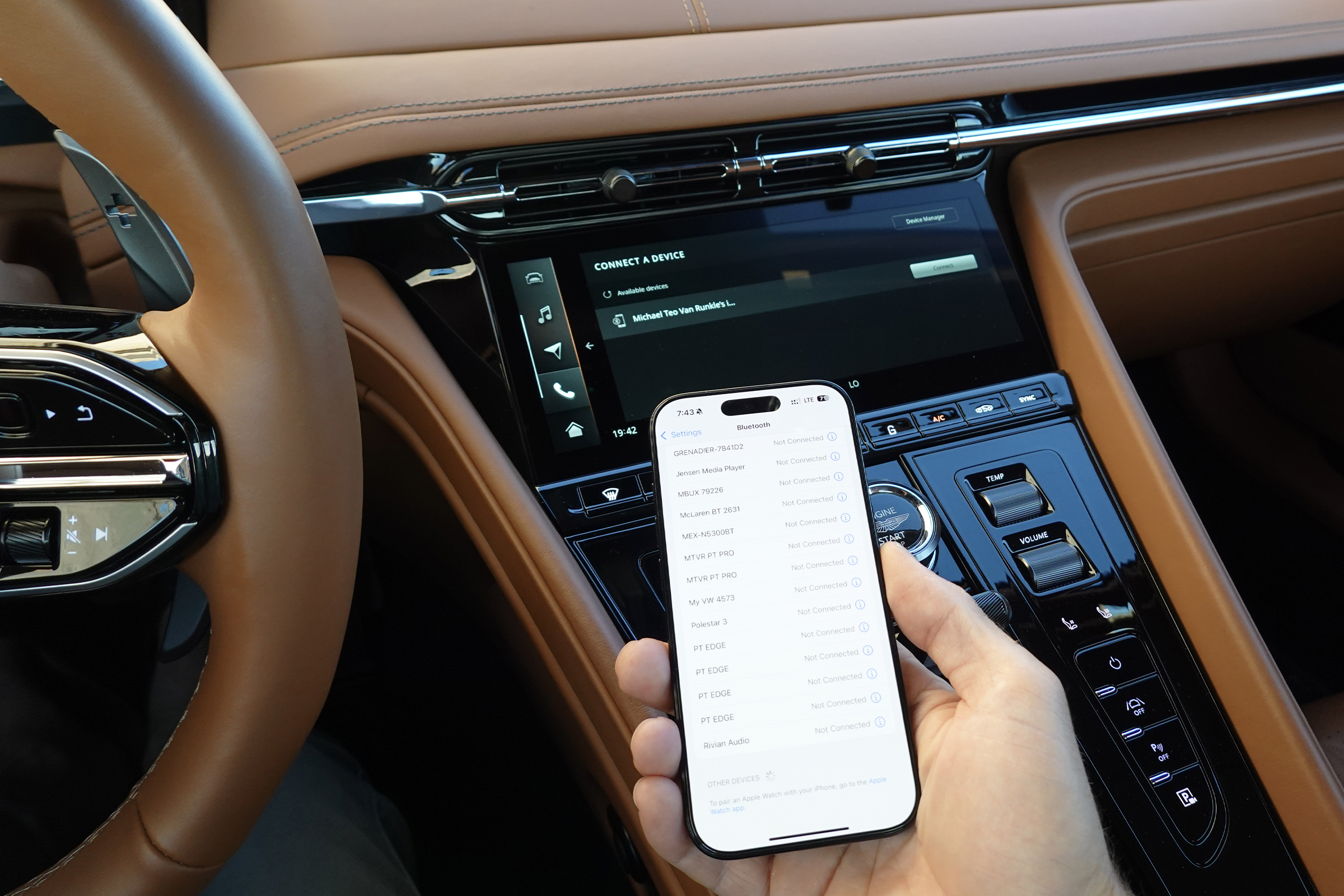 An iPhone connected to an Aston Martin using CarPlay ultra