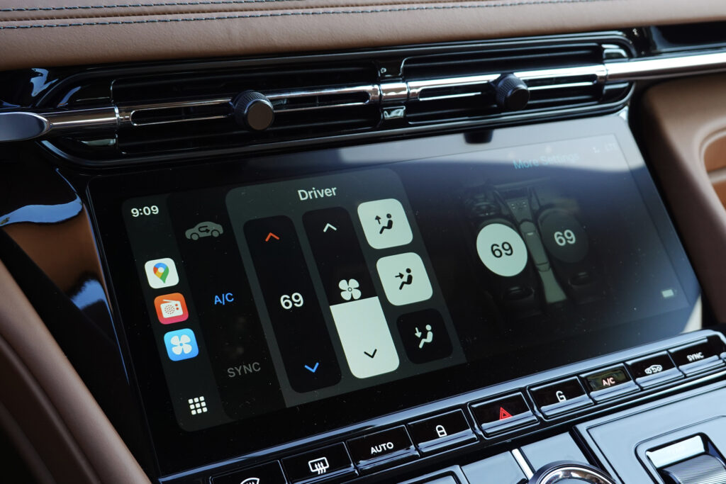 Aston Martin infotainment screen in CarPlay Ultra showing climate settings.