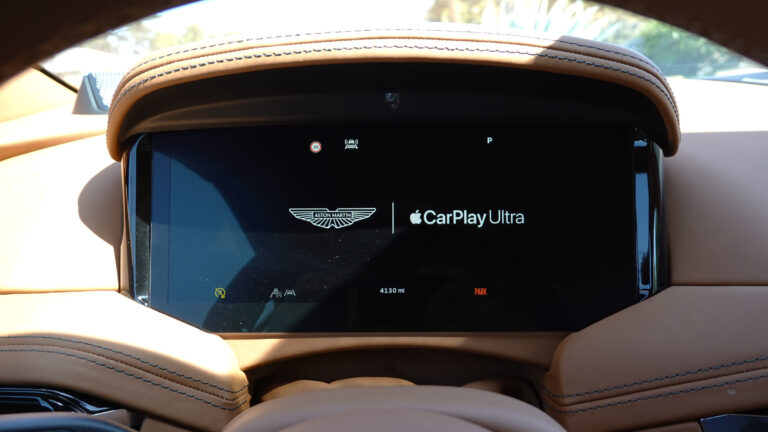 Aston Martin dashboard showing CarPlay ultra logo