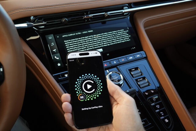 An iPhone connected to an Aston Martin using CarPlay ultra