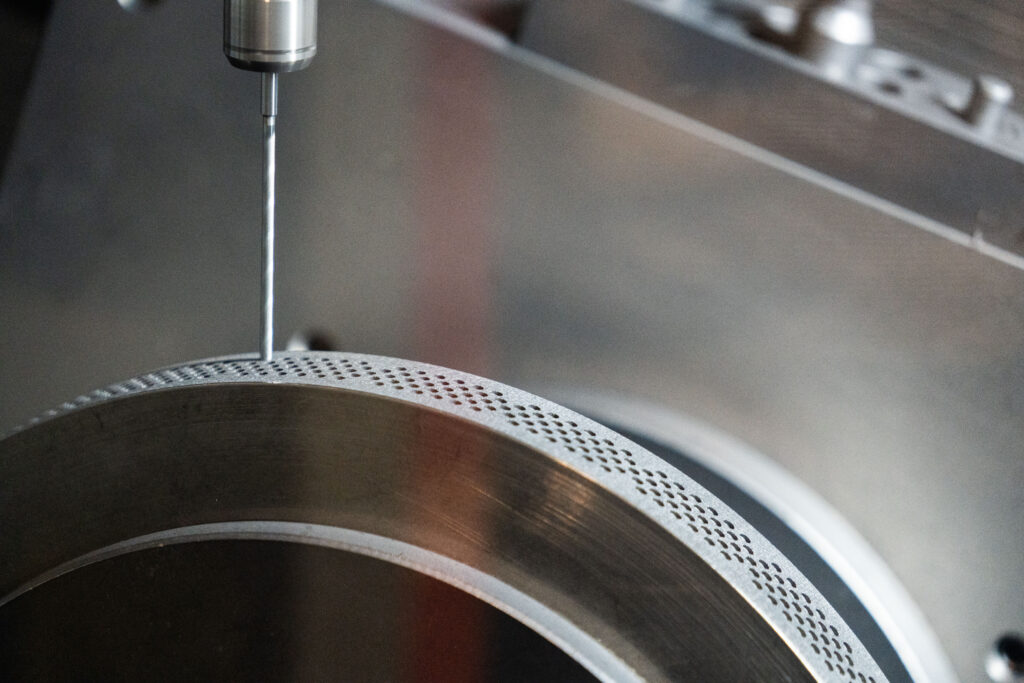 A brake disc being drilled