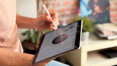 A man operates Blender on a tablet with a stylus
