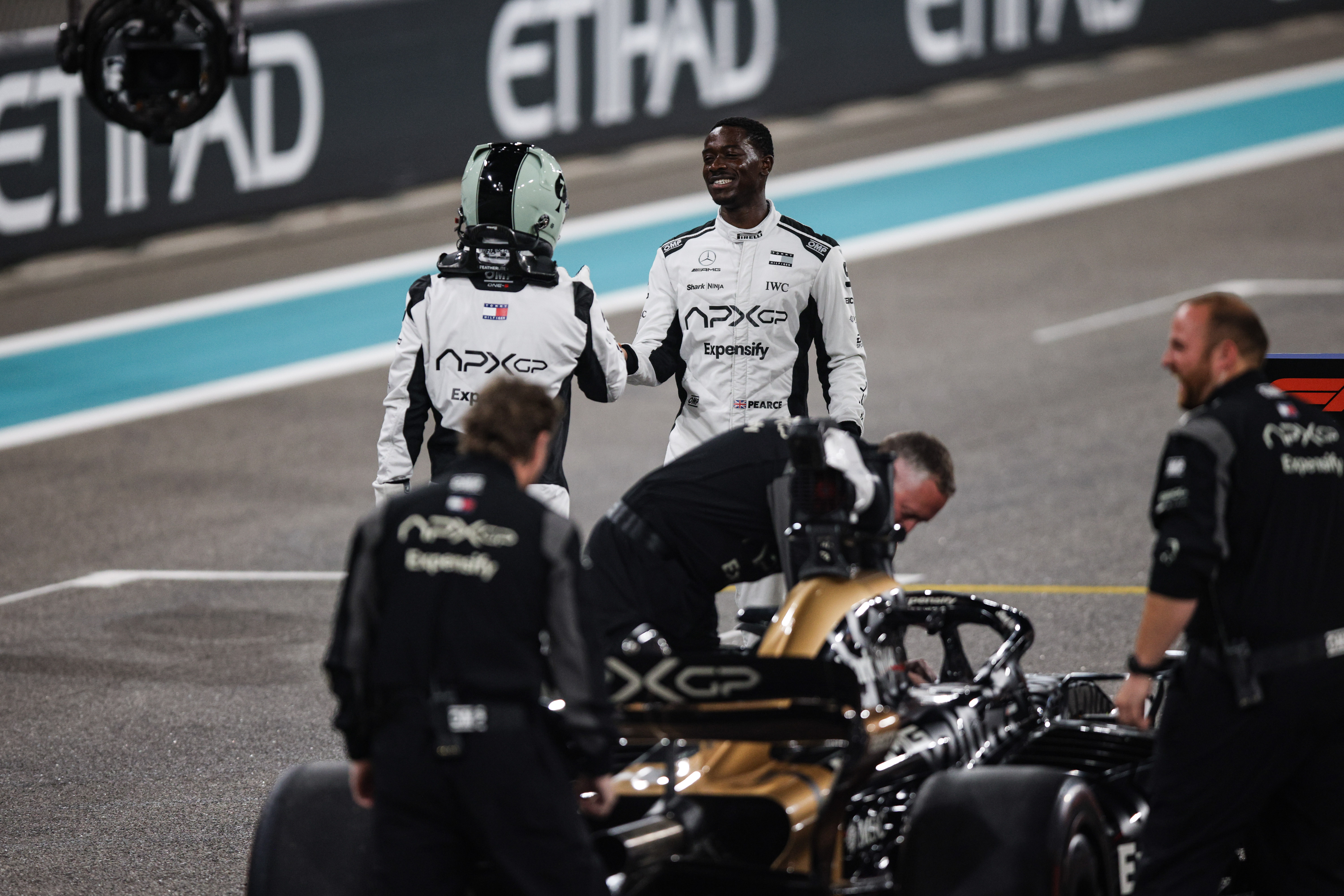Brad Pitt, an actor playing Sonny Hayes, and Idris Damson, a driver for the fictional APX GP team in the Apex F1 movie by Apple Studios and Bruckheimer Films, pose for a portrait during the F1 Grand Prix of Abu Dhabi at Yas Marina Circuit in Abu Dhabi, United Arab Emirates, on December 5 to 8, 2024.