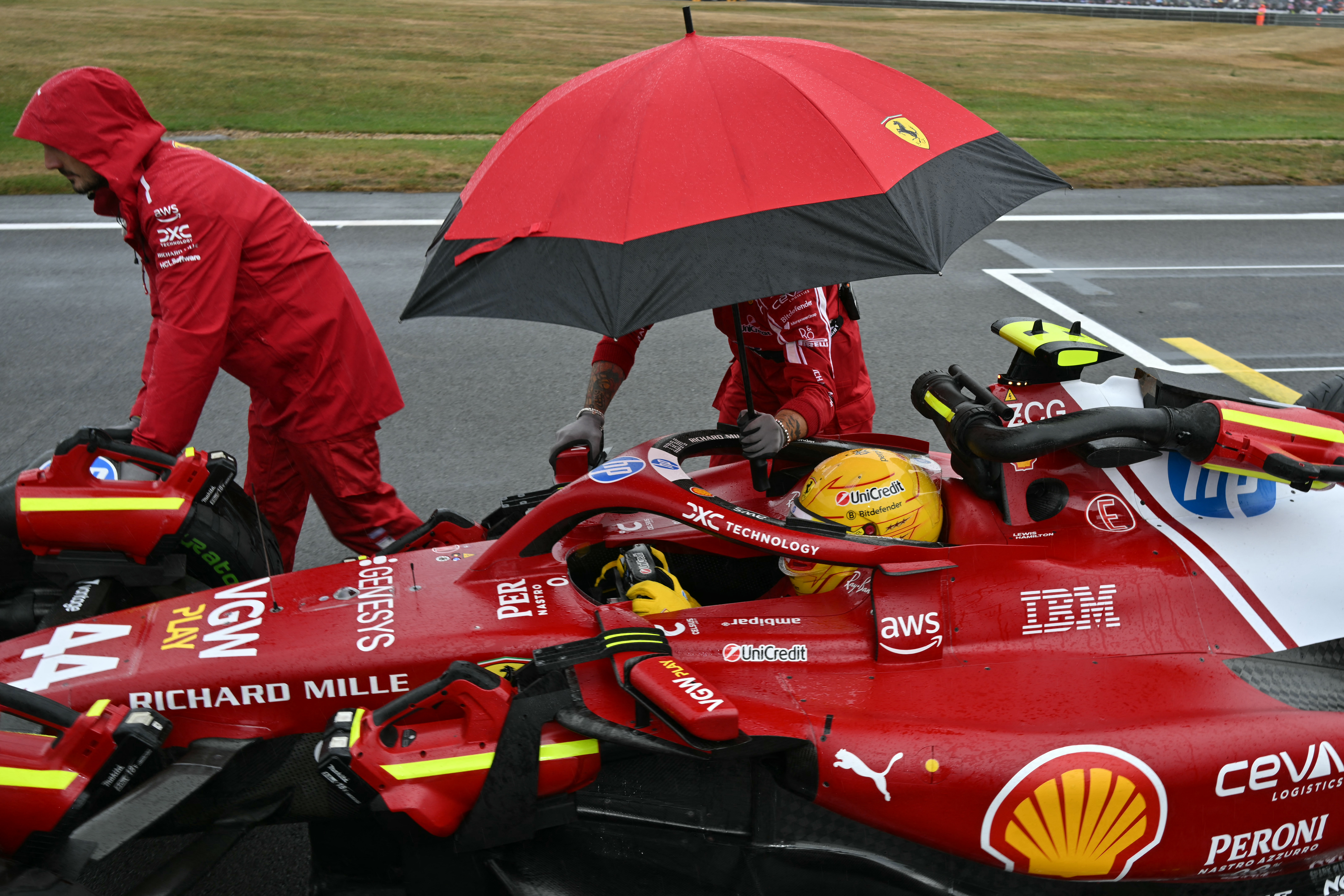 Ferrari's British driver Lewis Hamilton on the grid ahead of the Formula One British Grand Prix at the Silverstone motor racing circuit in Silverstone, central England, on July 6, 2025.