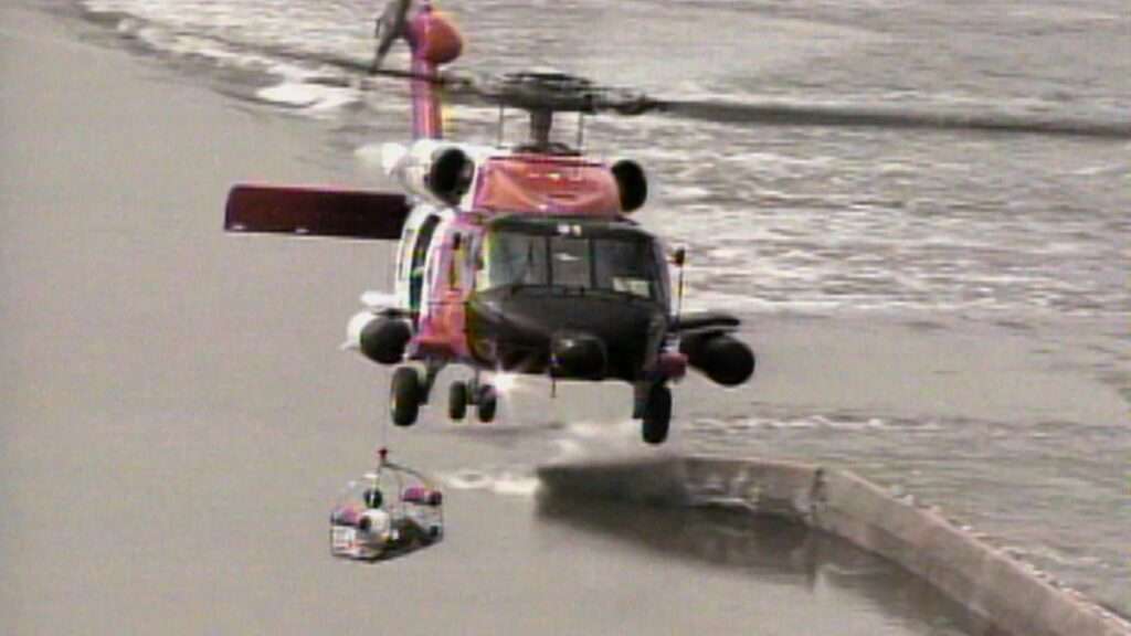 A helicopter carrying a rescued New Orleans resident takes flight during the aftermath of Hurricane Katrina.