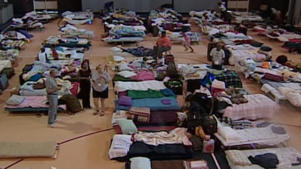 Stranded New Orleans residents gather in a shelter during Hurricane Katrina.