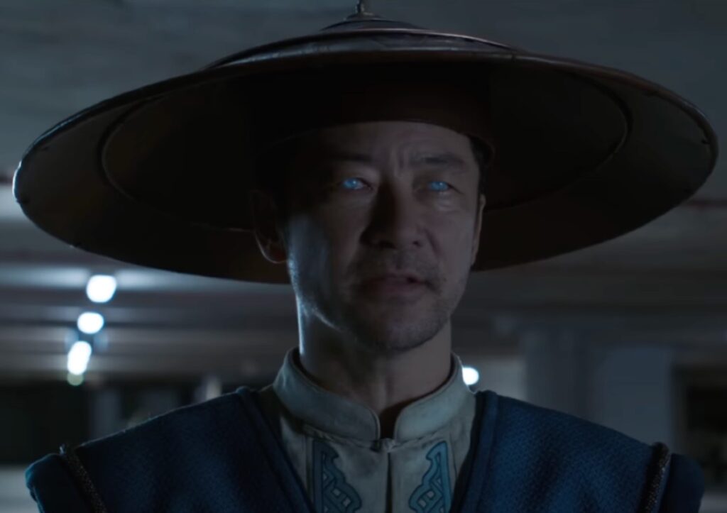 Asian man in period garb with blue glowing eyes