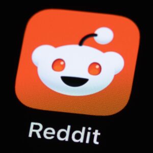 A Reddit app icon on a phone screen.
