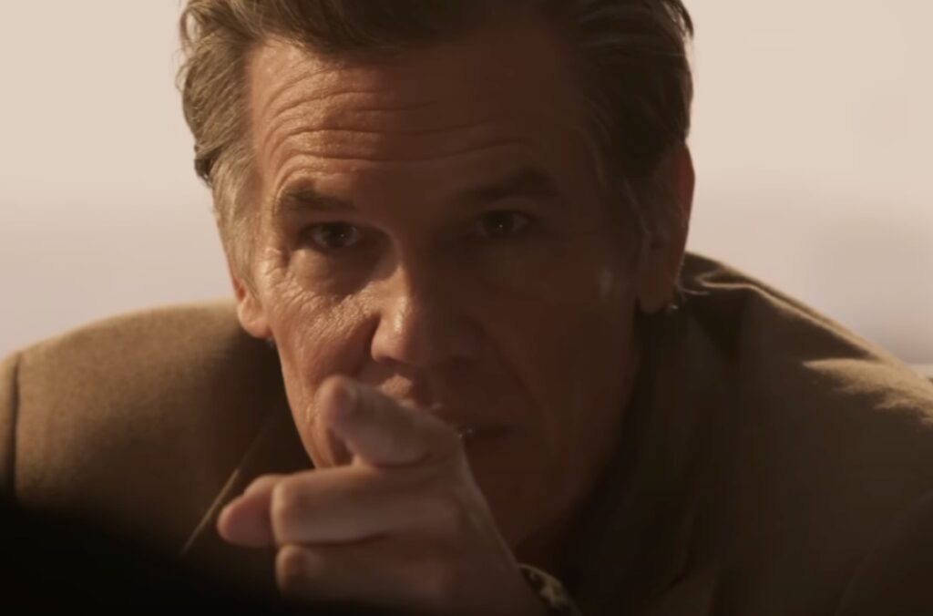 Close-up of Tough guy with lined and leathered face pointing a finger