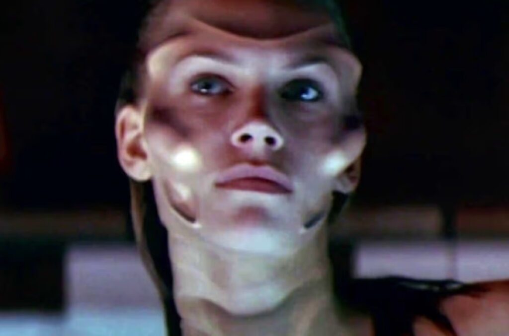 lovely young woman with tentacles visible under her facial skin.