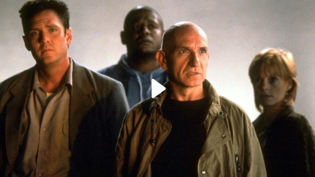 three men and a woman standing in a line looking determined